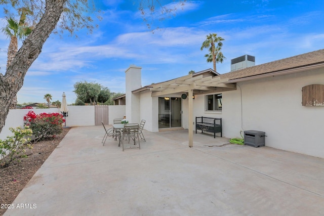 view of patio / terrace with outdoor dining area, fence, and a pergola