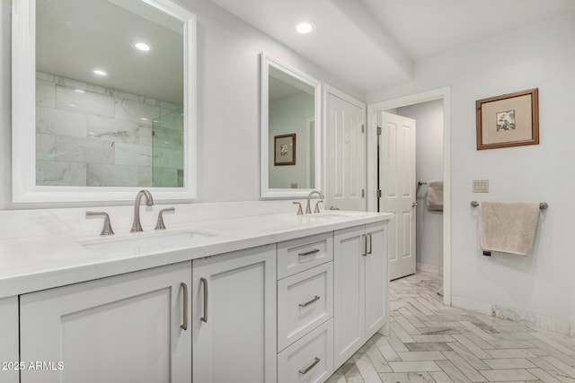 7955 E Chaparral Rd Unit 17, Scottsdale, AZ 85250 - bathroom with double vanity, recessed lighting, and a marble finish shower