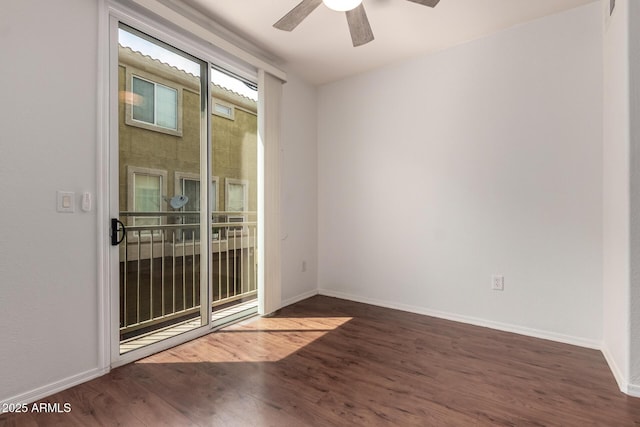 unfurnished room with baseboards, wood finished floors, and a ceiling fan