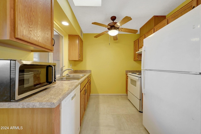 kitchen with ceiling fan, sink, and white appliances