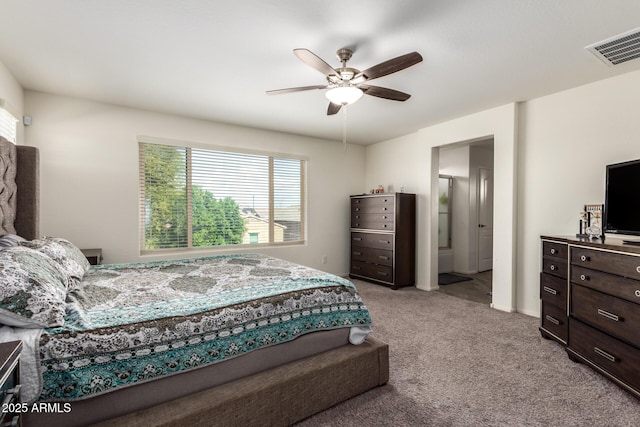 bedroom featuring light carpet, visible vents, and a ceiling fan