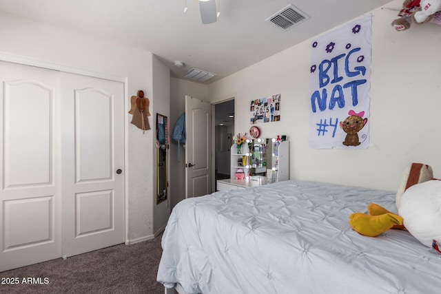 carpeted bedroom with a closet, a ceiling fan, and visible vents