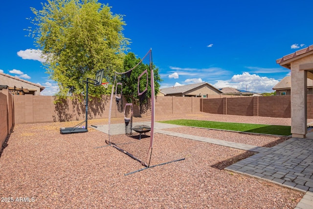 view of yard with a patio and a fenced backyard