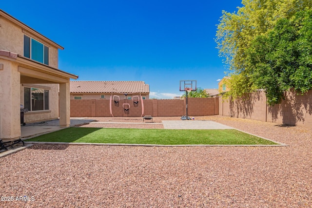 view of yard with a patio area and a fenced backyard