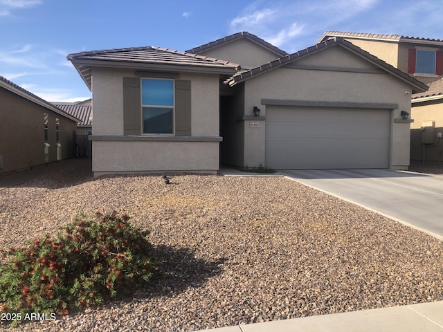 11505 W Boca Raton Rd, El Mirage, AZ 85335 - single story home featuring an attached garage, concrete driveway, a tiled roof, and stucco siding