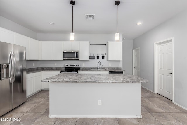 11505 W Boca Raton Rd, El Mirage, AZ 85335 - kitchen with stainless steel appliances, a kitchen island, a sink, white cabinetry, and decorative light fixtures