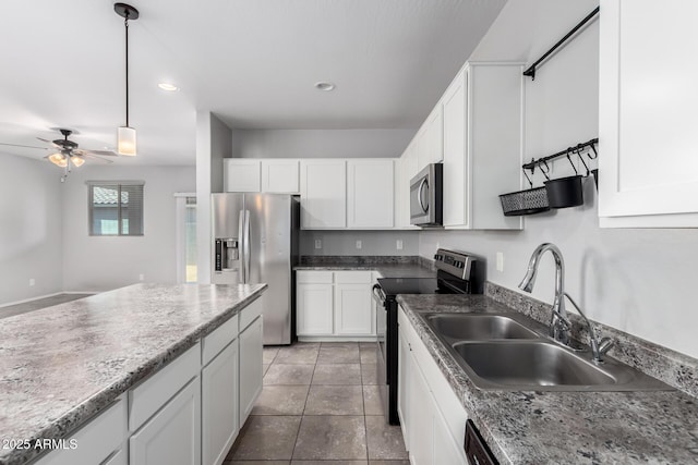 11505 W Boca Raton Rd, El Mirage, AZ 85335 - kitchen featuring appliances with stainless steel finishes, a sink, a ceiling fan, white cabinetry, and hanging light fixtures