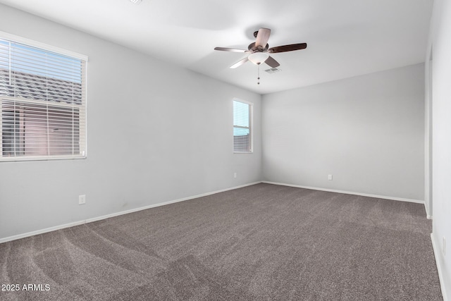 11505 W Boca Raton Rd, El Mirage, AZ 85335 - carpeted spare room with a ceiling fan and baseboards