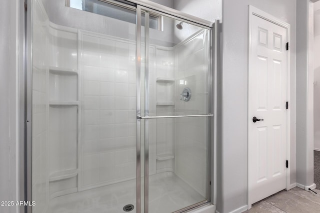 11505 W Boca Raton Rd, El Mirage, AZ 85335 - full bathroom with a stall shower and baseboards