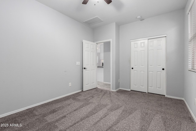 11505 W Boca Raton Rd, El Mirage, AZ 85335 - unfurnished bedroom with carpet flooring, a closet, and baseboards