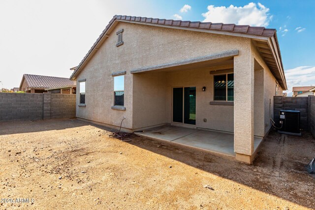 11505 W Boca Raton Rd, El Mirage, AZ 85335 - back of house with a patio area, a fenced backyard, central AC unit, and stucco siding