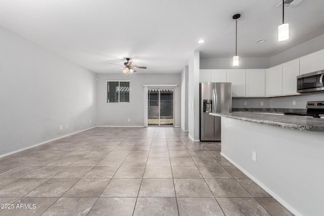 11505 W Boca Raton Rd, El Mirage, AZ 85335 - kitchen with stainless steel appliances, ceiling fan, white cabinets, light tile patterned floors, and hanging light fixtures