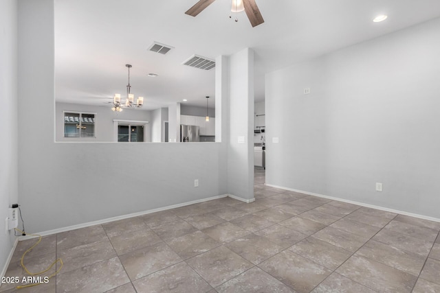 11505 W Boca Raton Rd, El Mirage, AZ 85335 - spare room featuring a ceiling fan, baseboards, and a chandelier
