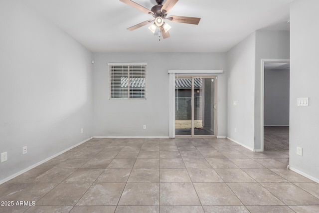 11505 W Boca Raton Rd, El Mirage, AZ 85335 - unfurnished room featuring a ceiling fan, tile patterned flooring, and baseboards