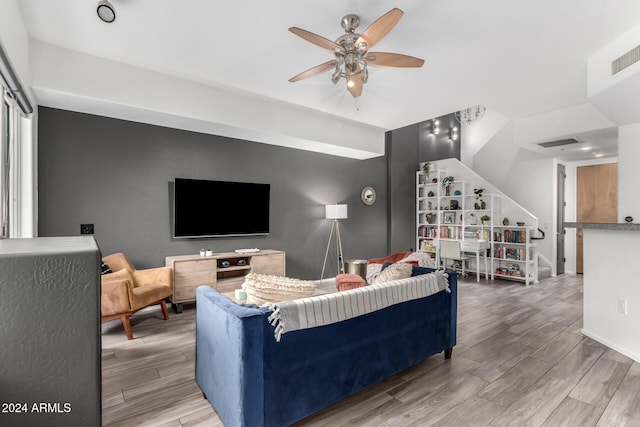 living room featuring ceiling fan