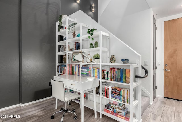 home office with hardwood / wood-style flooring