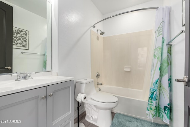 full bathroom with vanity, toilet, and shower / bath combo with shower curtain