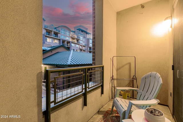 view of balcony at dusk