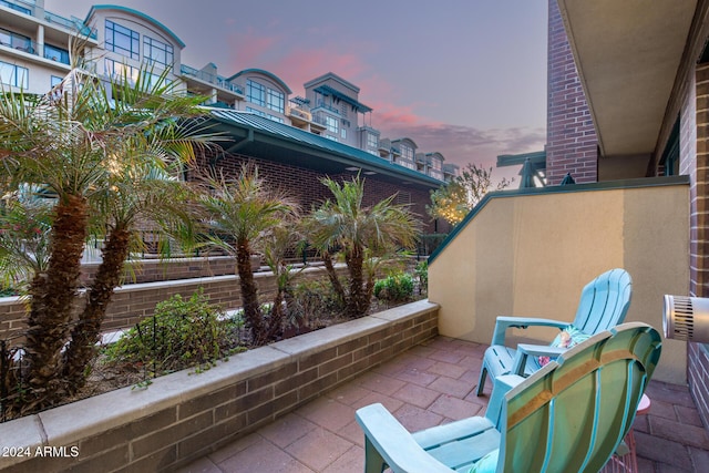 view of patio terrace at dusk