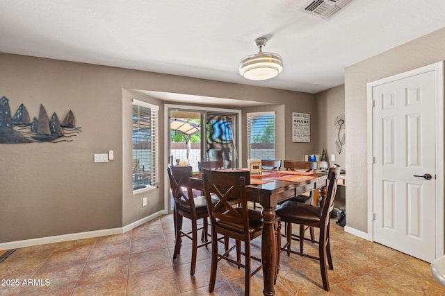 dining space featuring baseboards