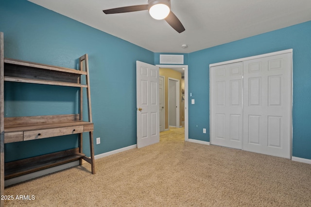bedroom with carpet floors, a closet, baseboards, and ceiling fan