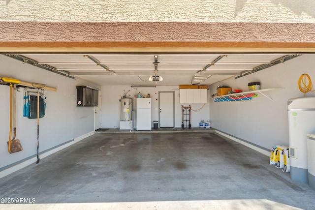 garage with freestanding refrigerator, a garage door opener, water heater, and baseboards