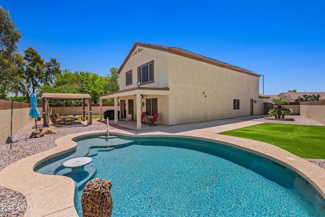 view of swimming pool featuring a patio area and a fenced backyard