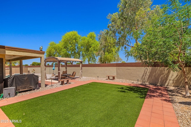view of yard with a gazebo and a patio