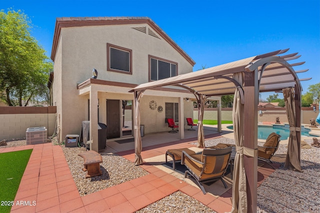 back of house featuring stucco siding, a patio, a fenced backyard, and central air condition unit