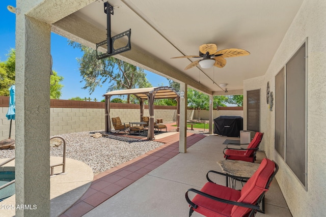 view of patio featuring a fenced backyard and ceiling fan