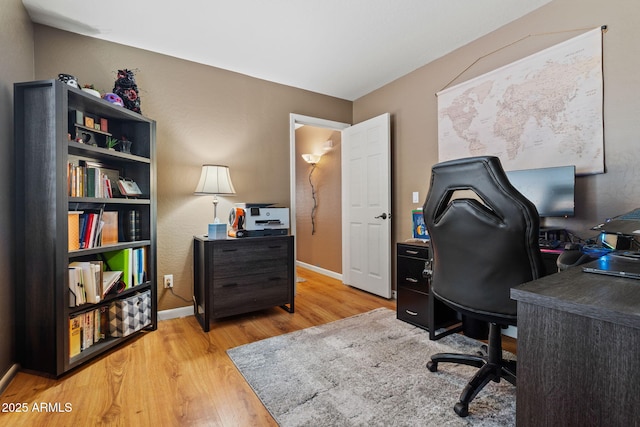 office with wood finished floors and baseboards