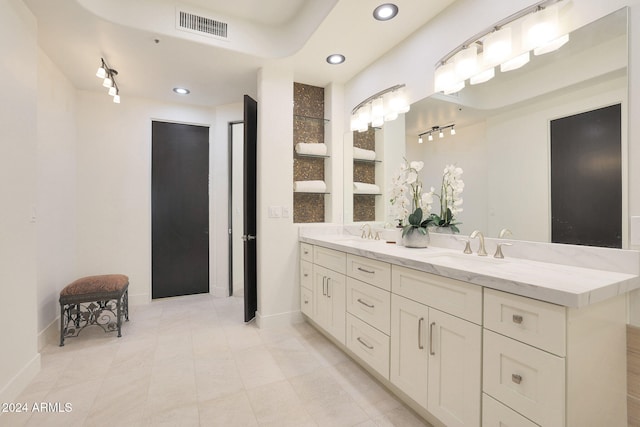 bathroom featuring tile patterned floors and vanity