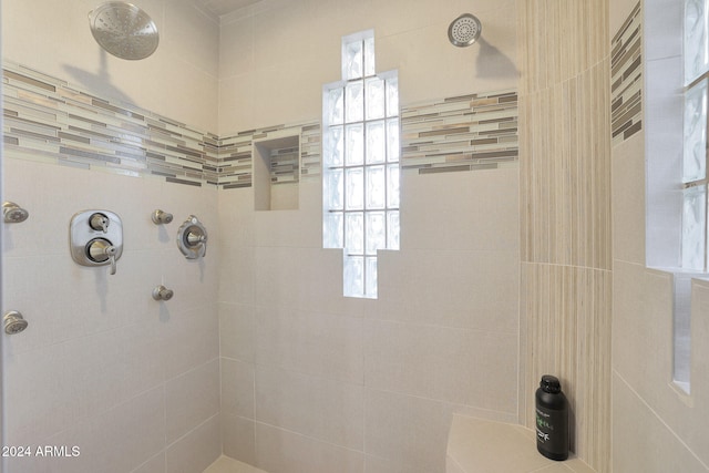 bathroom featuring tiled shower