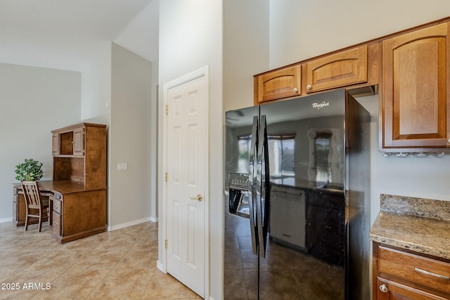 3649 E Hazeltine Way, Chandler, AZ 85249 - kitchen with black refrigerator with ice dispenser, light tile patterned floors, brown cabinetry, baseboards, and a high ceiling