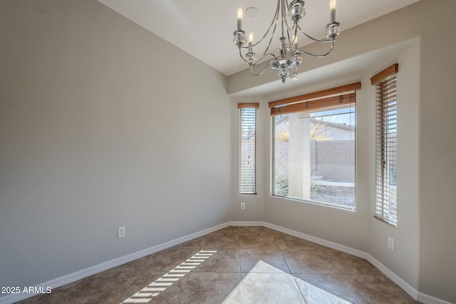 3649 E Hazeltine Way, Chandler, AZ 85249 - unfurnished dining area featuring a chandelier, tile patterned floors, and baseboards