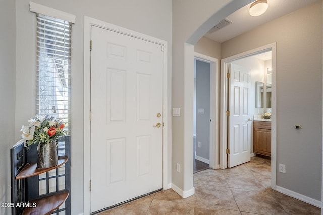 3649 E Hazeltine Way, Chandler, AZ 85249 - entryway with arched walkways, plenty of natural light, light tile patterned flooring, and baseboards
