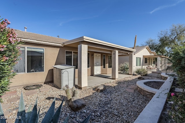 3649 E Hazeltine Way, Chandler, AZ 85249 - rear view of house featuring stucco siding and covered porch