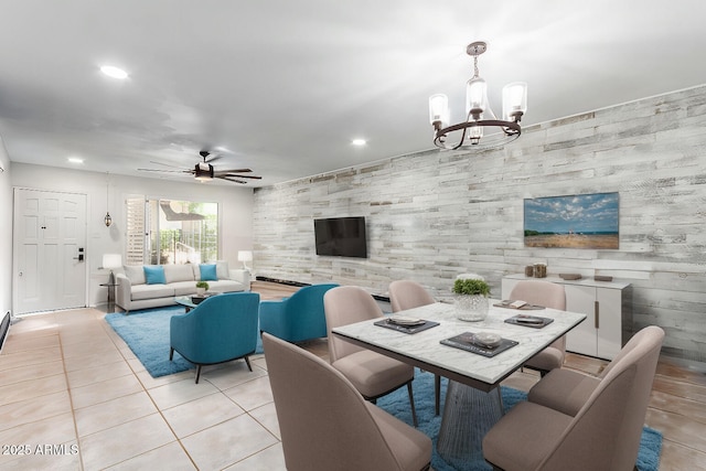 dining room featuring light tile patterned floors and ceiling fan with notable chandelier