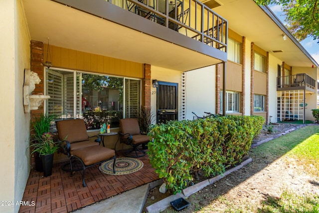 view of patio with a balcony