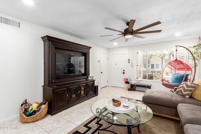 tiled living room with ceiling fan