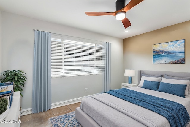 bedroom with ceiling fan and light tile patterned floors