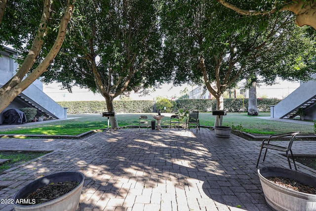 view of patio / terrace featuring stairway