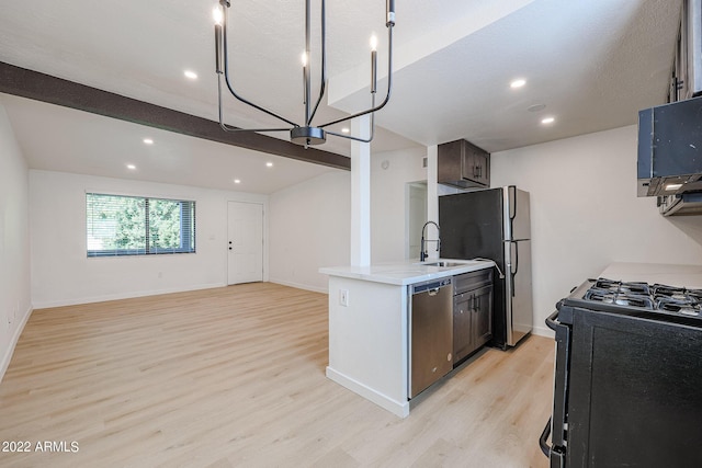 kitchen with baseboards, light wood-style flooring, vaulted ceiling with beams, appliances with stainless steel finishes, and open floor plan