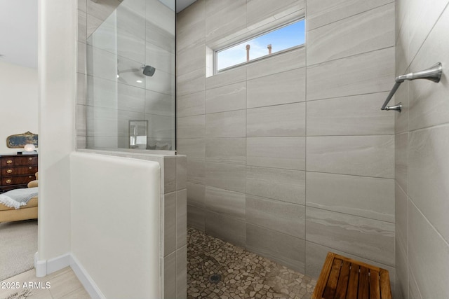 bathroom featuring tiled shower