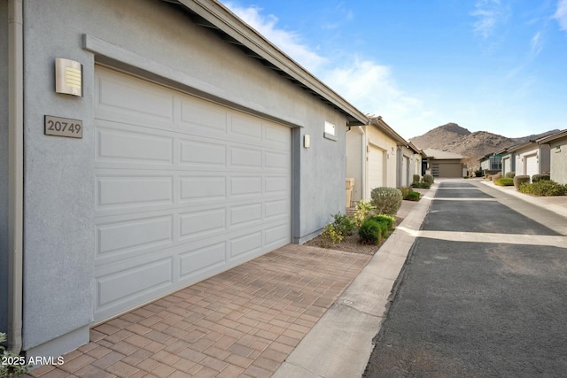 garage featuring a mountain view