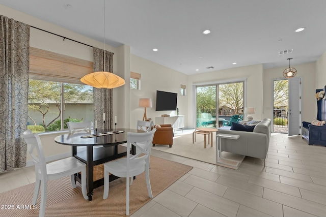 dining area with light tile patterned flooring