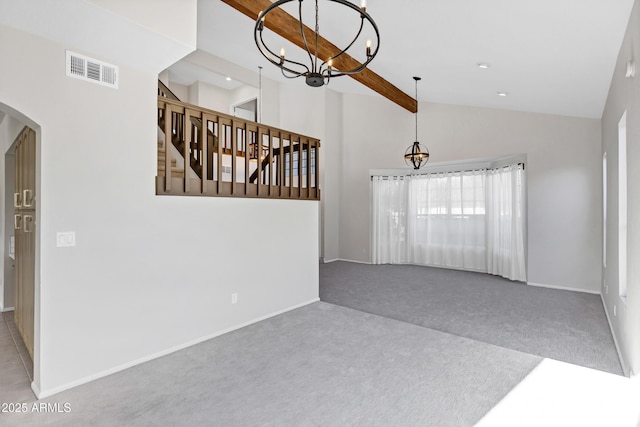 carpeted empty room featuring high vaulted ceiling, beam ceiling, and a notable chandelier