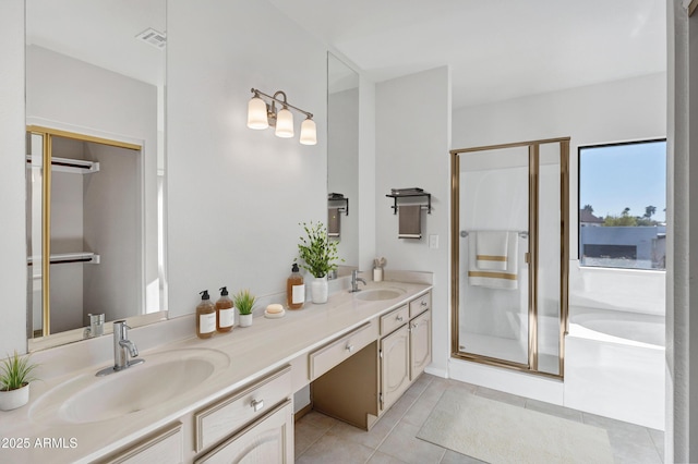 bathroom featuring tile patterned floors, vanity, and separate shower and tub