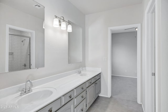 bathroom featuring a shower, tile patterned floors, and vanity