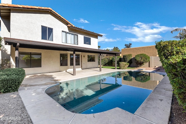 view of pool featuring a diving board and a patio area